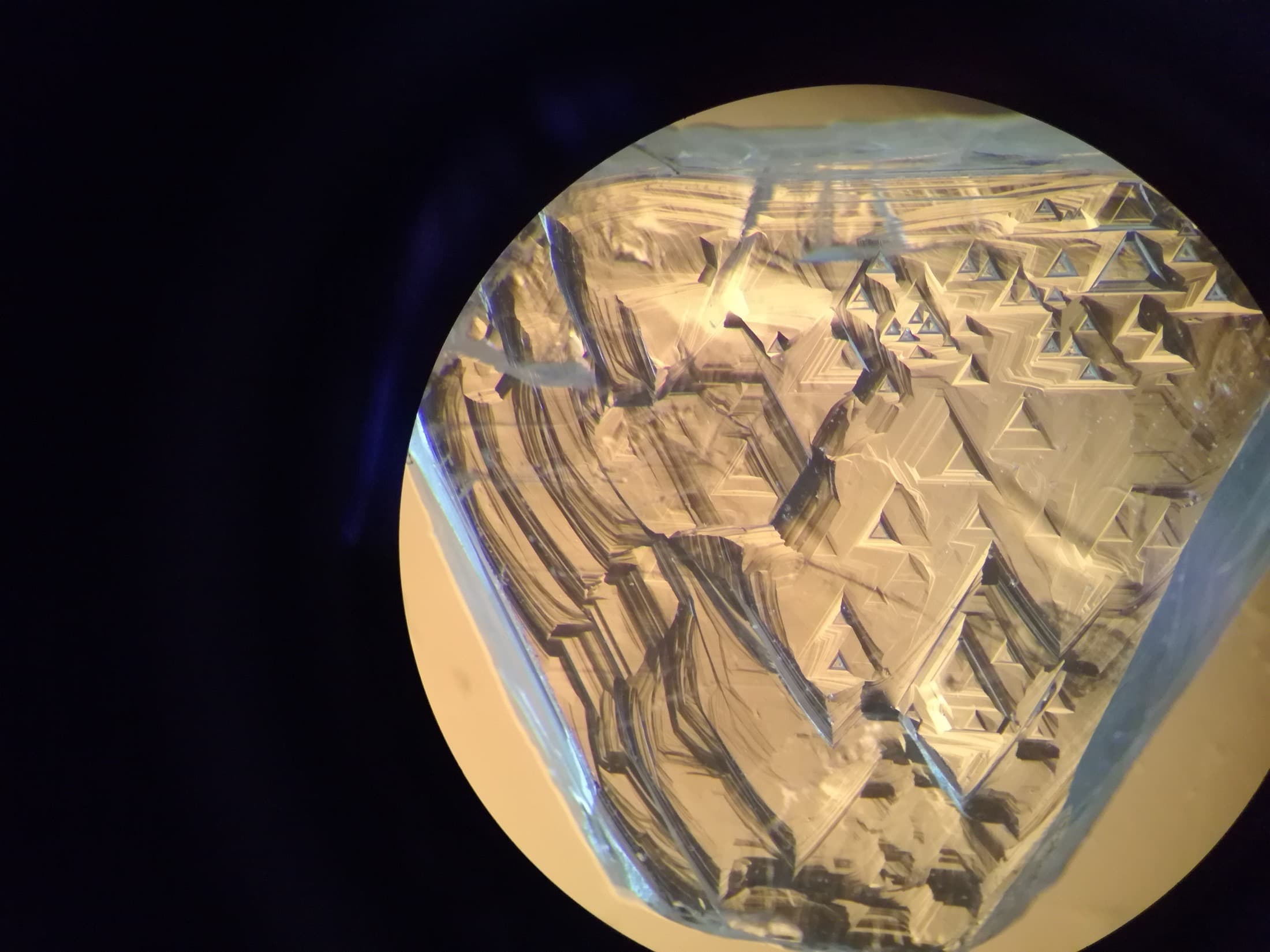 Extreme macro detail of a diamond's crystal facets